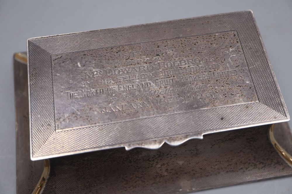 A George V engine turned silver mounted double inkwell, of flared form, with engraved inscription